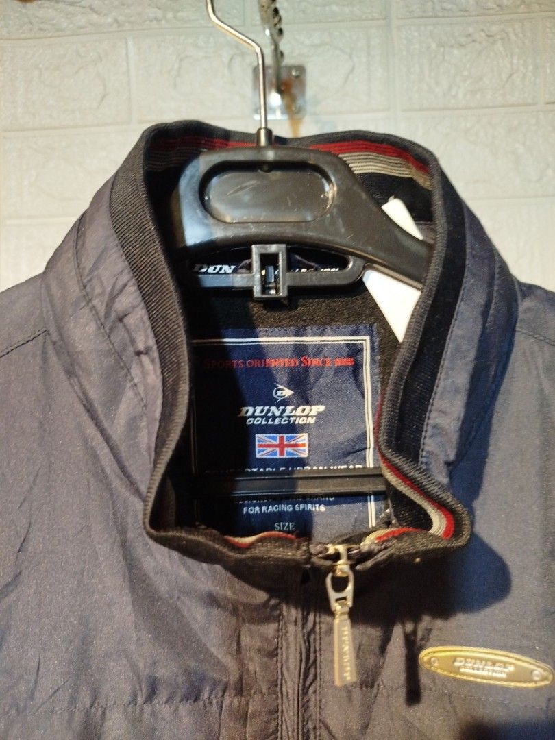 Dunlop Collection Vest (Category: Vests) located in Quezon City. Submitted by madrilejod31663 (Listing ID 1413763189, Image 2). Description: - Dunlop Collection vest in navy blue - Full zipper closure - Two front pockets - Stand-up collar - Dunlop Collection logo on chest - Small logo on lower right side - Small chest pocket - Sleeveless design.