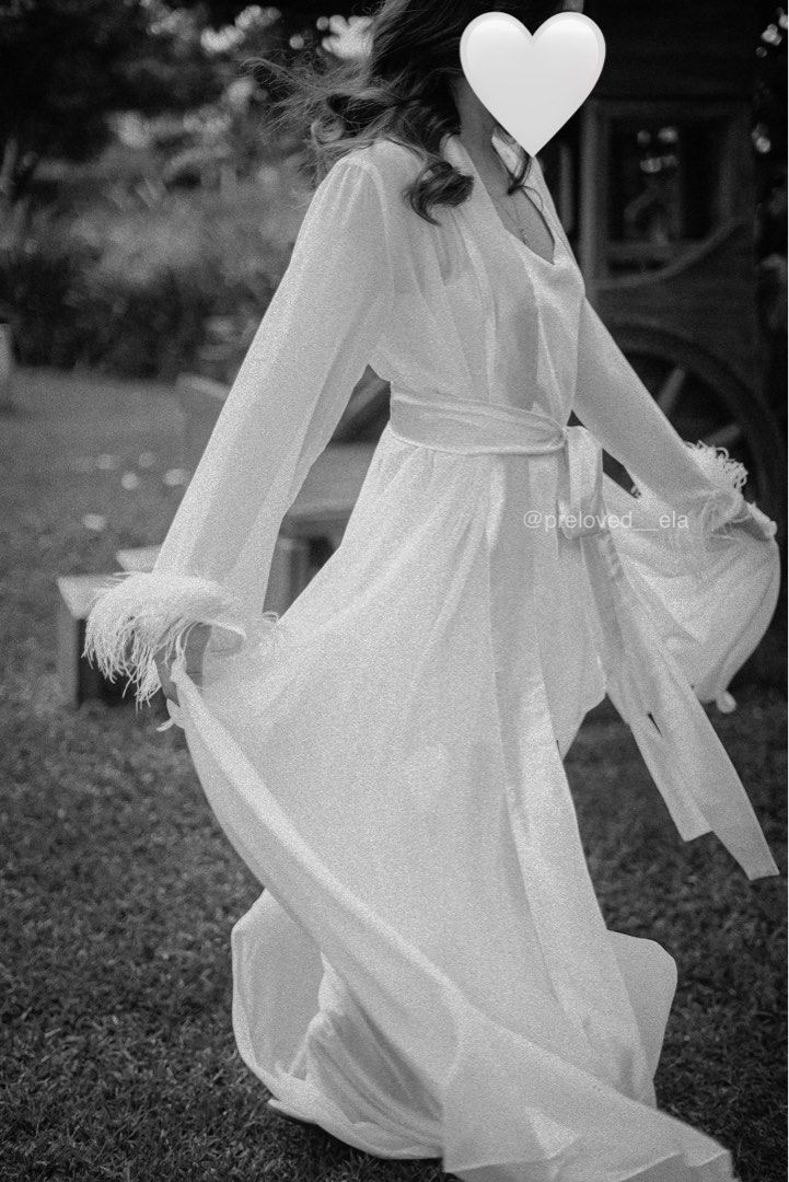 Eve The Label Marie Bridal Dressing Robe (Category: Undergarments & Loungewear) located in Makati City. Submitted by preloved___ela (Listing ID 1413688003, Image 3). Description: Eve The Label Marie Dressing Robe - Medium on tag but can fit S-M frames - Features feather detailing on sleeves - Two layers of feathers - Used as a bridal prep robe.