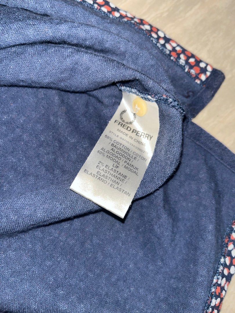 Fred Perry Twin Tipped Polo (Category: Sleeveless) located in Manila. Submitted by coolthreadss (Listing ID 1413723874, Image 3). Description: Fred Perry "M3600" Twin Tipped Polo • Brand: Fred Perry. • Model: M3600 — The modern, streamlined adaptation of the original 1950s design. • Colorway: Classic Black with signature Yellow-Gold "Twin Tipping" on the collar and cuffs. • Material: 100% Cotton Piqué — breathable, durable heavyweight fabric that