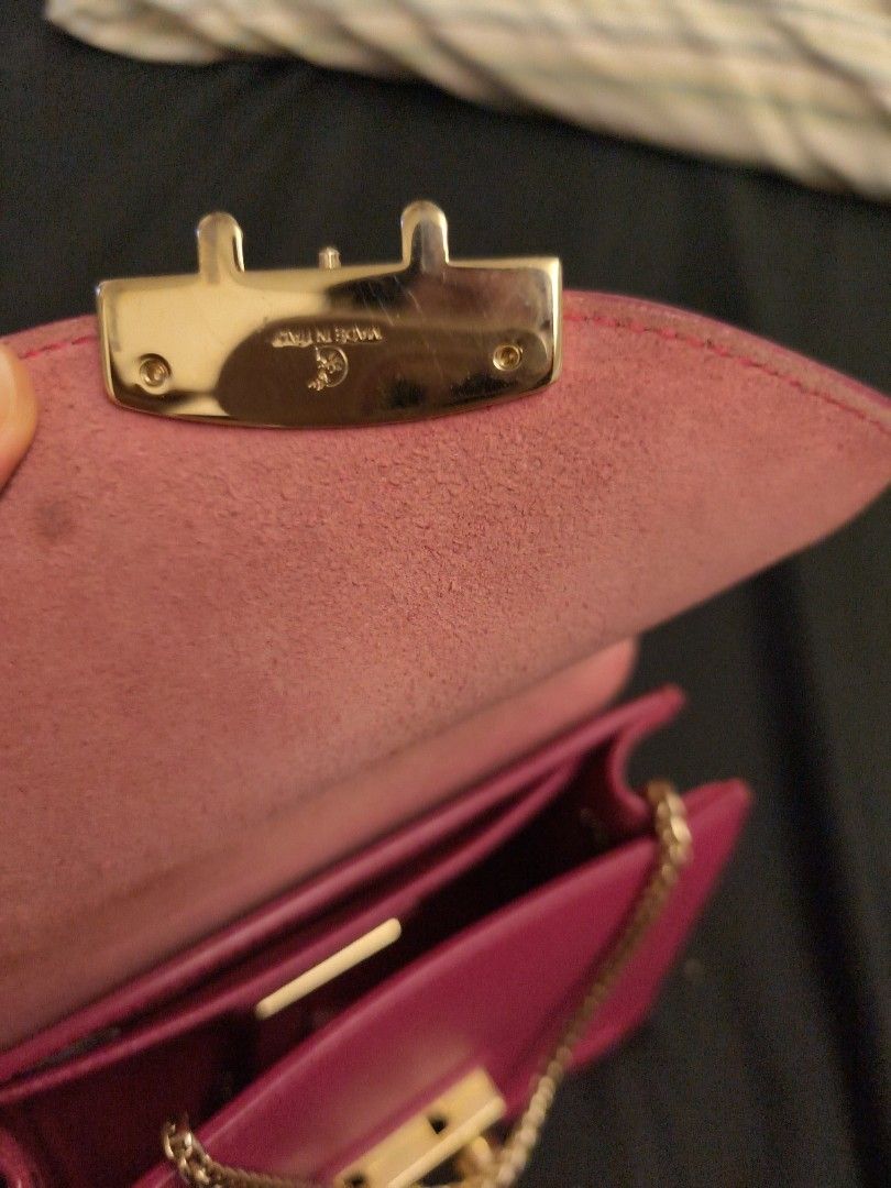 Furla Metropolis Mini Crossbody Bag (Category: Luxury Bags & Wallets) located in Quezon City. Submitted by desireditem (Listing ID 1413729280, Image 3). Description: - Furla Metropolis Mini crossbody bag - Eye-catching magenta color - Gold-tone clasp with Furla logo - Red fabric interior with small pocket - Detachable chain strap GOOD CONDITION .