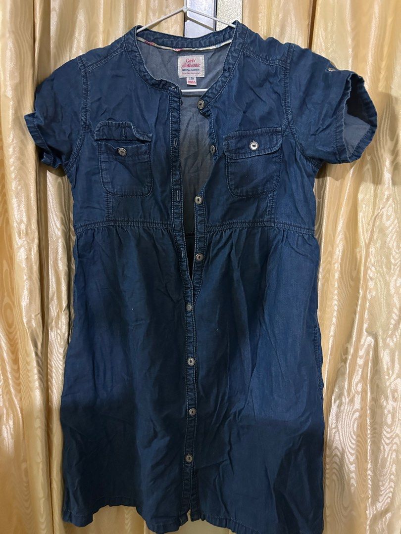 Girls' Authentic Denim Dress - Size 150 (Category: Babies & Kids Fashion) located in San Carlos. Submitted by kyennn (Listing ID 1413819921, Image 1). Description: - Girls' Authentic denim dress - Size 150 - Dark blue color - Button-down front - Short sleeves - Two front pockets - Collar - Made in Cambodia.