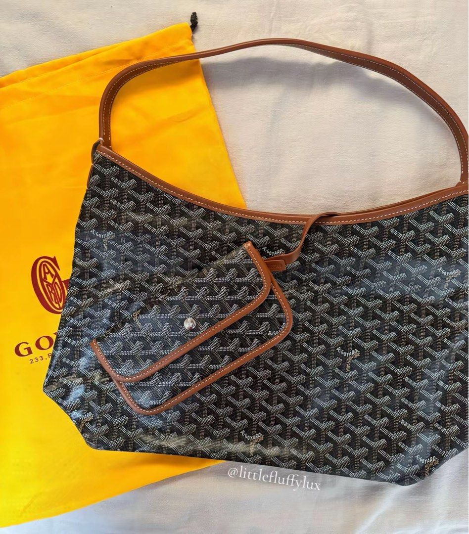 Goyard Hobo Bag (Category: Luxury Bags & Wallets) located in Pasig City. Submitted by littlefluffylux (Listing ID 1413753754, Image 2). Description: - Black and Tan color (two tone) - Classic Goyardine pattern - Brown leather trim and strap - Detachable pouch included - Interior features snap closure - Goyard Paris Made in France stamp - Comes with dust bag .