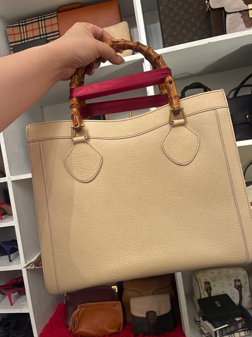 Gucci Bamboo Handle Tote Bag (Category: Luxury Bags & Wallets) located in Marilao. Submitted by wardrovearchives (Listing ID 1413778706, Image 2). Description: Authentic Gucci Vintage Diana -Bamboo Handle -Excellent outside condition with minor wear and tear but barely noticeable -Guaranteed Authentic -Excellent Hardware Issue: scuffing inside but already cleaned and got new felt bag organizer Perfect for bag Collector.