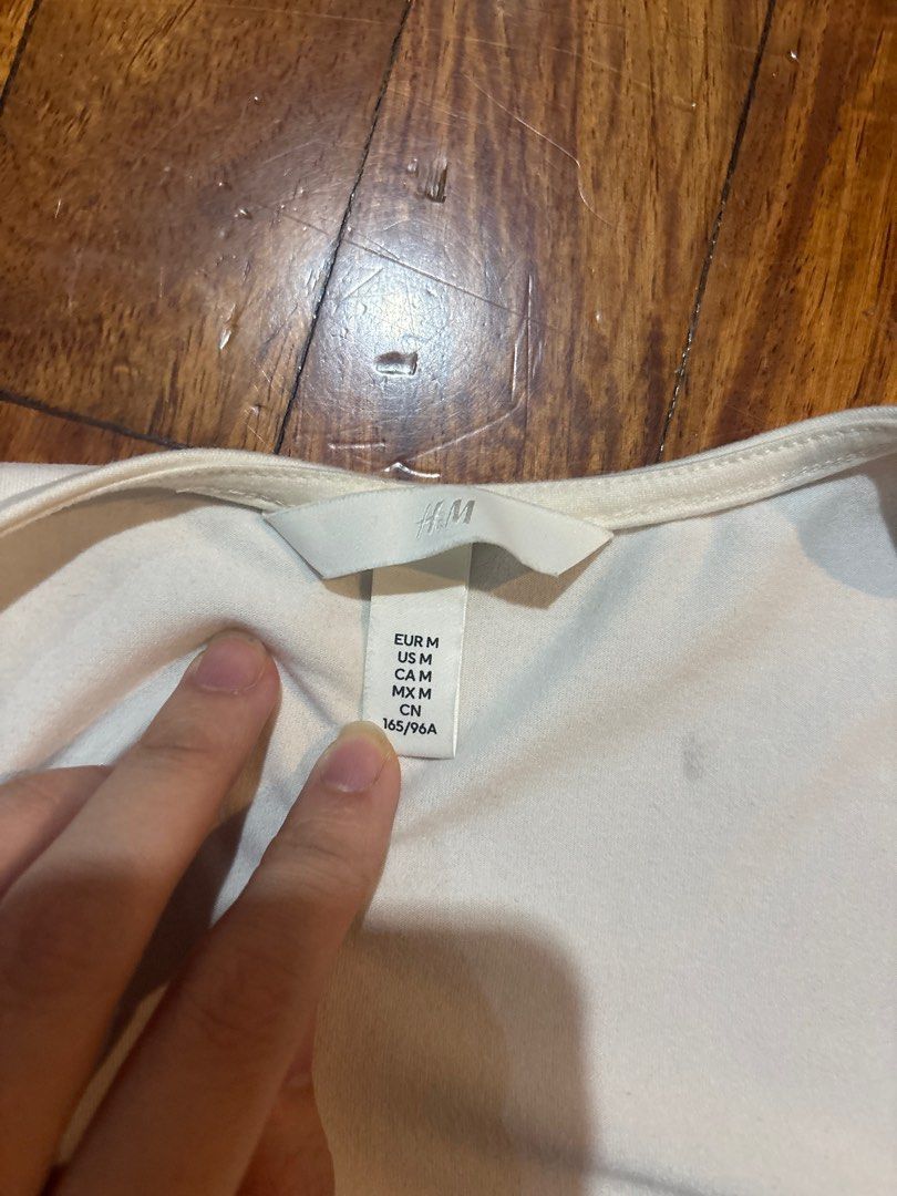 H&M Square Neck Long Sleeve Top - Size M (Category: Blouses) located in Quezon City. Submitted by threadsnthings.co (Listing ID 1413811993, Image 2). Description: - H&M cream-colored long sleeve top - Features a flattering square neckline - Size: Medium (M) - Made from a smooth, likely stretchy fabric - Simple and elegant design - Perfect for layering or cooler weather.