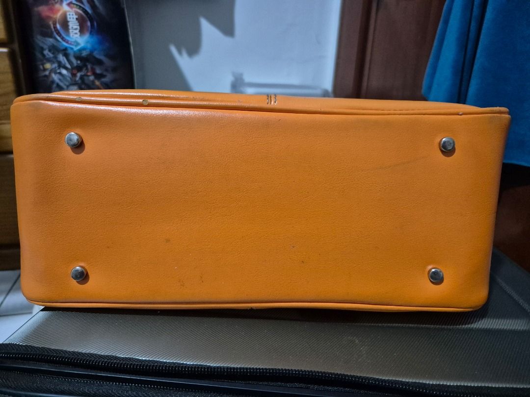Light Orange Handbag (Category: Tote Bags) located in Quezon City. Submitted by jamcreates (Listing ID 1413799137, Image 2). Description: Light orange handbag, classic design Durable material with multiple compartments Super Good condition (pls check photos), super minimal flaws Loc: Proj 7, QC.