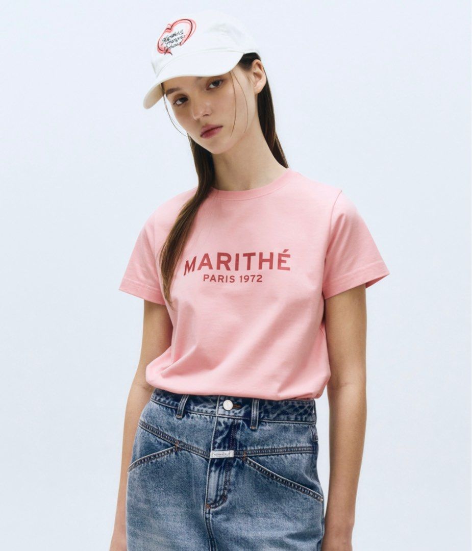 Marithe w regular logo tee (Category: Shirts) located in Singapore. Submitted by adlvclothing (Listing ID 1413753552, Image 3). Description: Authentic from Korea Size M only. White / Pink / Blue PTP: 48CM, LENGTH 56CM.