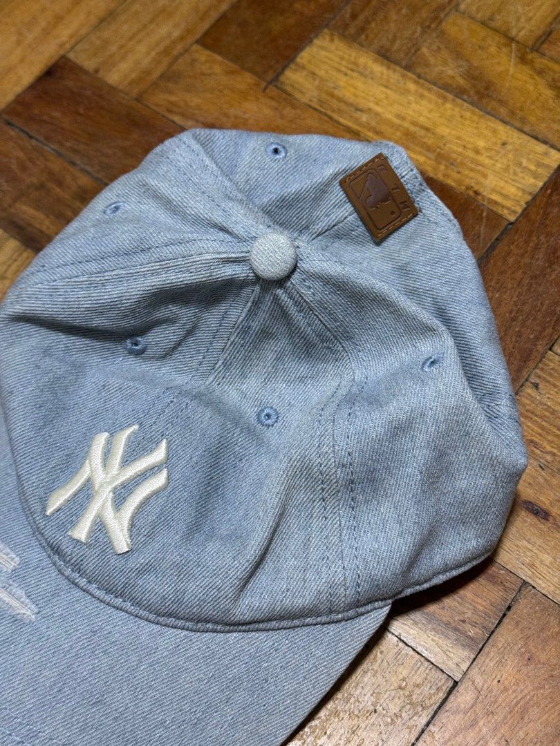 MLB New York Yankees Cap (Category: Caps & Hats) located in Taguig. Submitted by nadineagoncillo (Listing ID 1413790148, Image 3). Description: - Authentic New York Yankees cap. - Light blue denim material. - Features a distressed, worn look. - Adjustable strap for a perfect fit. - MLB logo present inside..