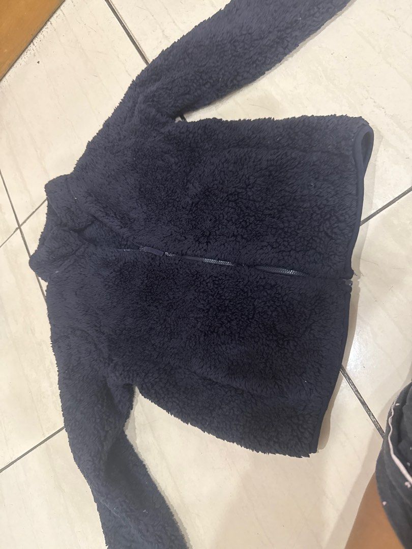 Navy Blue Fleece Jacket uniqlo (Category: Coats, Jackets and Outerwear) located in Makati City. Submitted by ps_techhouse (Listing ID 1413704041, Image 1). Description: - Navy blue fleece jacket - Full zipper closure - High collar size 140 - Long sleeves - Soft, textured material - Solid color.