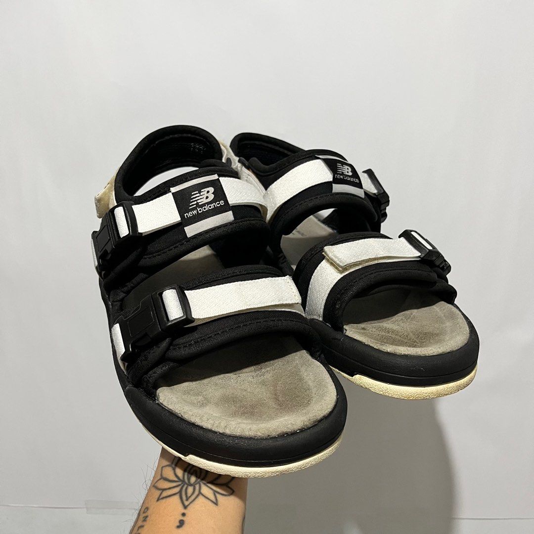 New Balance Classic Caravan Sandals (Category: Slippers & Slides) located in Quezon City. Submitted by migz23 (Listing ID 1413726440, Image 1). Description: - New Balance sandals - Color: Black and White - Adjustable straps for a secure fit - Light grey footbed - Unique tread pattern - New Balance logo on straps and footbed - Ideal for casual wear Gcash/Gotyme/Meetup Loc: Fairview/SM Fairview.