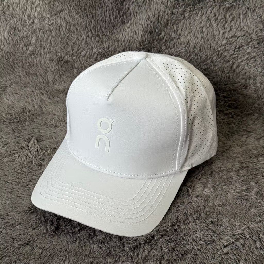 On Running Cap (Category: Caps & Hats) located in Manila. Submitted by useyourcommonsense (Listing ID 1413748176, Image 3). Description: - On Running cap - Available colors: Black, White, Blue, Gray - Features brand logo - Curved brim - Perforated side panels for breathability - Ideal for running and everyday use.