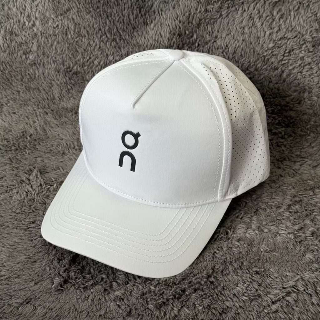On Running Cap (Category: Caps & Hats) located in Manila. Submitted by useyourcommonsense (Listing ID 1413748176, Image 2). Description: - On Running cap - Available colors: Black, White, Blue, Gray - Features brand logo - Curved brim - Perforated side panels for breathability - Ideal for running and everyday use.