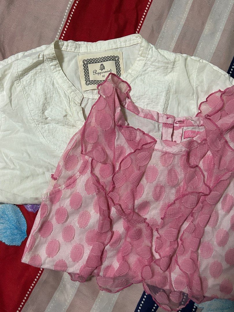 Peppermint White Top and Pink Polka Dot Top (Category: Blouses) located in San Carlos. Submitted by kyennn (Listing ID 1413819187, Image 1). Description: - Two tops included - White top from Peppermint, size 10 - Pink polka dot top with ruffles - Great for everyday wear and special occasions - Versatile wardrobe additions.