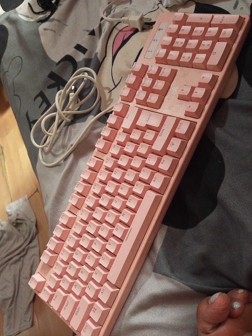 Pink Mechanical Keyboard (Category: Computer Keyboard) located in Manila. Submitted by sarrajanep55738 (Listing ID 1413682529, Image 1). Description: - Full-sized pink mechanical keyboard - Includes numeric keypad - Wired connection - Light pink color - Pink keycaps.