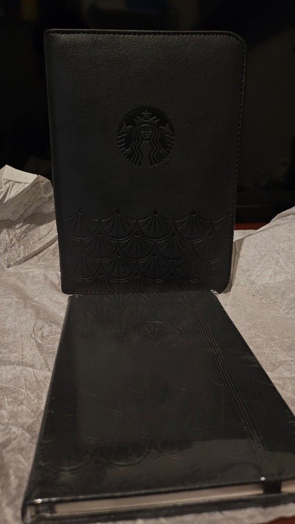 Starbucks 2022 Classic Black Organizer with Planner (Category: Stationery & School Supplies) located in Quezon City. Submitted by johnsandhens (Listing ID 1413699906, Image 2). Description: The organizer included built-in pockets designed to hold a pen, Starbucks cards, and other essentials. Interior Pages: Inside, the planner contained: Weekly and monthly calendar pages. 35 dotted blank pages for notes and journaling. 12 exclusive monthly artwor