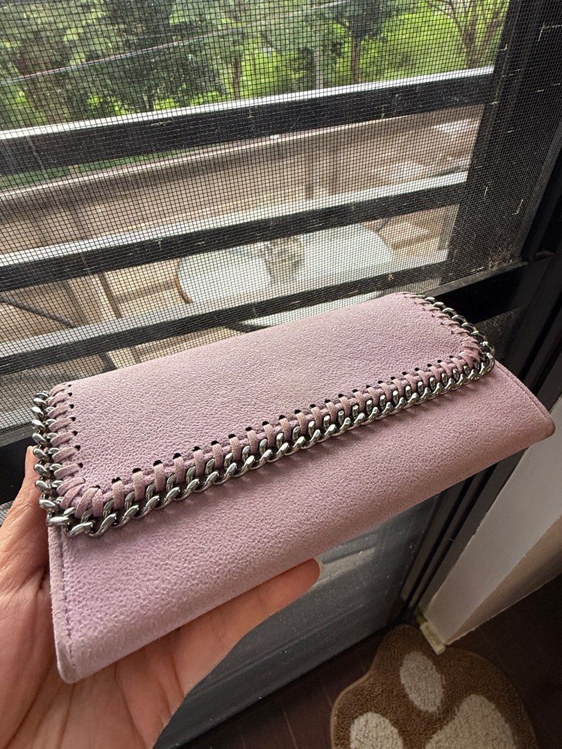 Authentic Stella McCartney Chain Wallet (Category: Luxury Bags & Wallets) located in Binangonan. Submitted by pinkesceeluxe (Listing ID 1413815082, Image 2). Description: - 100% Authentic or Money Back (provided you have a documentation from a Third-Party Authenticator) - Light pink / Light lilac wallet (color varies depending on lighting) - Chain detail - Suede fabric - Snap closure - Multiple card slots - Zippered compartment - Stella McCartney