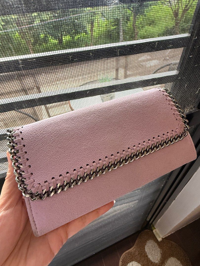 Authentic Stella McCartney Chain Wallet (Category: Luxury Bags & Wallets) located in Binangonan. Submitted by pinkesceeluxe (Listing ID 1413815082, Image 1). Description: - 100% Authentic or Money Back (provided you have a documentation from a Third-Party Authenticator) - Light pink / Light lilac wallet (color varies depending on lighting) - Chain detail - Suede fabric - Snap closure - Multiple card slots - Zippered compartment - Stella McCartney