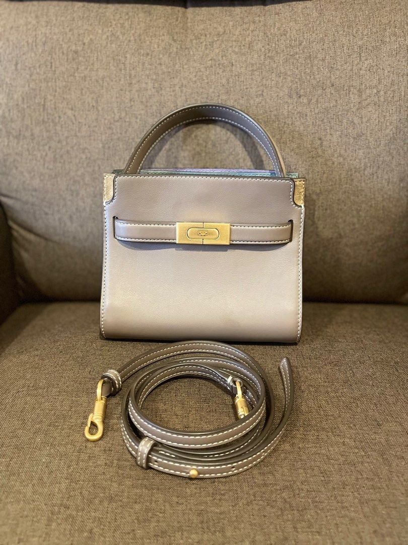 Tory Burch small Lee Radziwill Double shoulder bag (Category: Luxury Bags & Wallets) located in Muntinlupa City. Submitted by jnjsluxury (Listing ID 1413717052, Image 1). Description: Authentic Like New!!! Retails at 40k+ in pesos Bought from Singapore No inclusion Composition Body: Leather 100% Lining: Cotton 100% Shipping via lalamove Meet ups at Evia Mall or Alabang Town Center Only - Tory Burch satchel bag - Neutral grey color - Top handle an