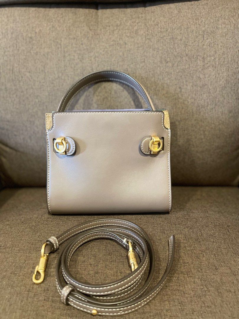 Tory Burch small Lee Radziwill Double shoulder bag (Category: Luxury Bags & Wallets) located in Muntinlupa City. Submitted by jnjsluxury (Listing ID 1413717052, Image 3). Description: Authentic Like New!!! Retails at 40k+ in pesos Bought from Singapore No inclusion Composition Body: Leather 100% Lining: Cotton 100% Shipping via lalamove Meet ups at Evia Mall or Alabang Town Center Only - Tory Burch satchel bag - Neutral grey color - Top handle an