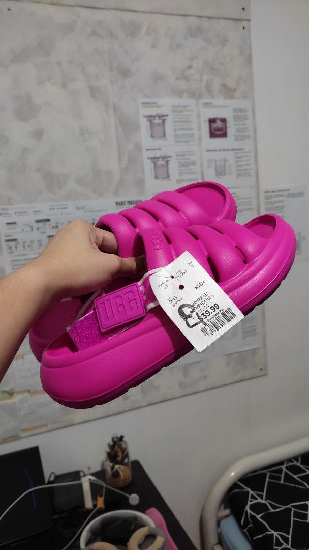 UGG Women's Pink Sandals (Category: Flats & Sandals) located in Las Pinas. Submitted by ceejayeusebio (Listing ID 1413819507, Image 2). Description: - Authentic UGG sandals - Vibrant pink color - Padded design for comfort - Includes original tags - Features UGG logo strap - Pink soles ‼️RFS: Bigay lang sakin. The color doesn't suit me. Never been worn. 🚚 Delivery - Shouldered by buyer 📍Location - Las Piñas 💵 Mode of Payment; -Bank Transfer -Gc