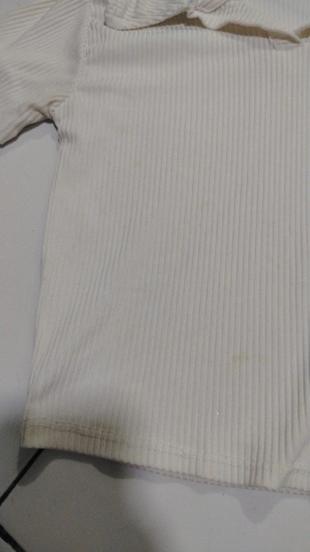 White Ribbed Polo Top (Category: Blouses) located in Manila. Submitted by loveeroded (Listing ID 1413764062, Image 3). Description: - Cream-colored ribbed polo top - Collared neckline - Short sleeves - Cropped style - Vertical ribbing - Minor stains on front.
