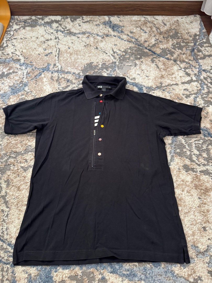 Y-3 Yohji Yamamoto Adidas Polo Shirt - Black - M (Category: Tshirts & Polo Shirts) located in Singapore. Submitted by mzbar (Listing ID 1413676562, Image 1). Description: - Authentic Y-3 polo shirt - Color: Black - Size: M - Condition: Good (minimal wear) - Features: Unique button design, Y-3 logo on back - Made in Thailand - Stylish addition to your wardrobe.