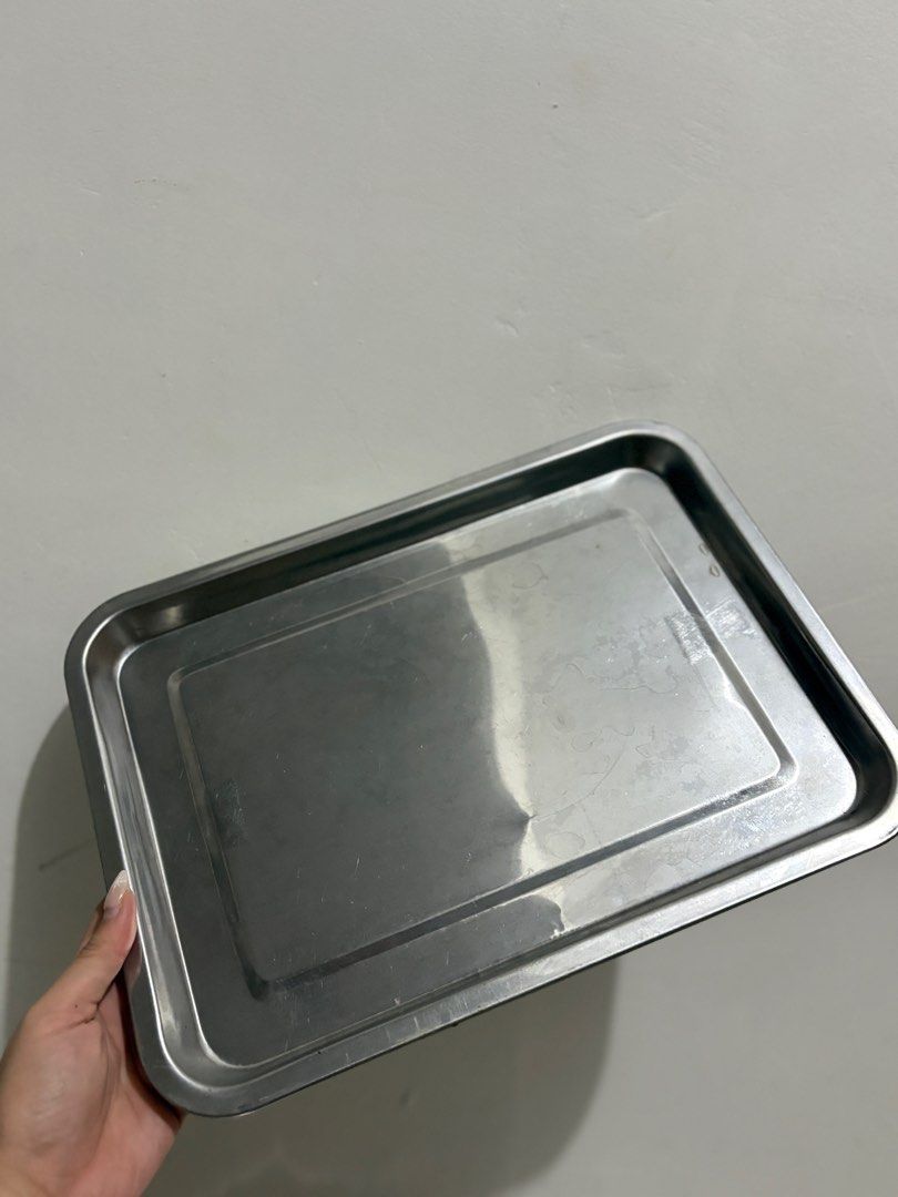 555 Stainless Steel Baking Trays (Category: Bakeware) located in Pasig City. Submitted by katetatin (Listing ID 1413995303, Image 2). Description: - Set of stainless steel baking trays - Rectangular shape with slightly raised edges - Stackable design for easy storage - Minor marks on the surface - Versatile for baking, serving, and general kitchen tasks -100 each available 2 pcs - Size: 36x27.