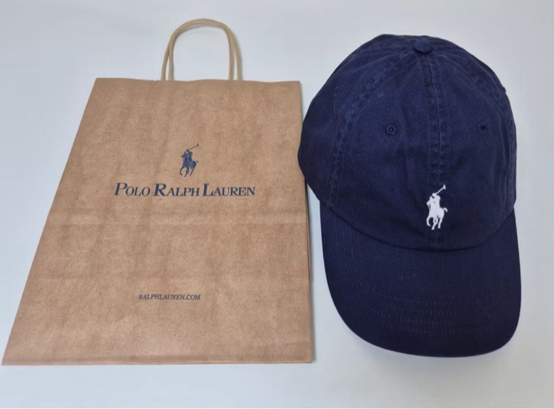 AUTHENTIC POLO RALPH LAUREN CHINO BASEBALL CAP (Category: Hats & Beanies) located in San Pedro. Submitted by jasdecluttersph (Listing ID 1413907334, Image 2). Description: - Navy blue Polo Ralph Lauren cap - Made of soft material - Features a curved brim - Classic design - Ideal for everyday wear - POLO RALPH LAUREN CHINO BASEBALL CAP. Bought in minimalkorea dot ph online store. Comes with RL paperbag. 100% Authentic. .