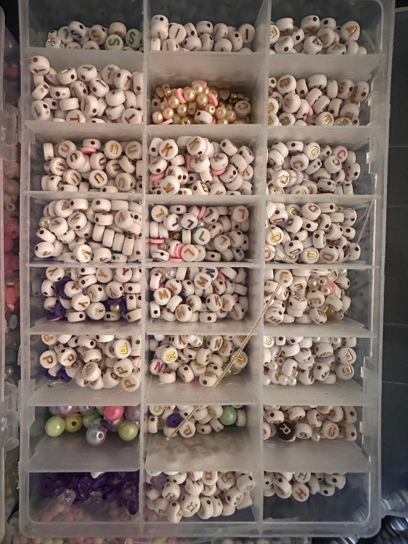 Beads Set (Category: Craft Supplies & Tools) located in Quezon City. Submitted by ak.stt (Listing ID 1413881473, Image 3). Description: - TAKE ALL BEADS SET -Massive bead collection for jewelry making (costs 2k+) - Includes round, star, flower, and letter beads. - Comes with a clear organizer box. - Includes a bag of alphabet beads. - Additional elastic string for easy crafting -Still negotiable for sure buyer.