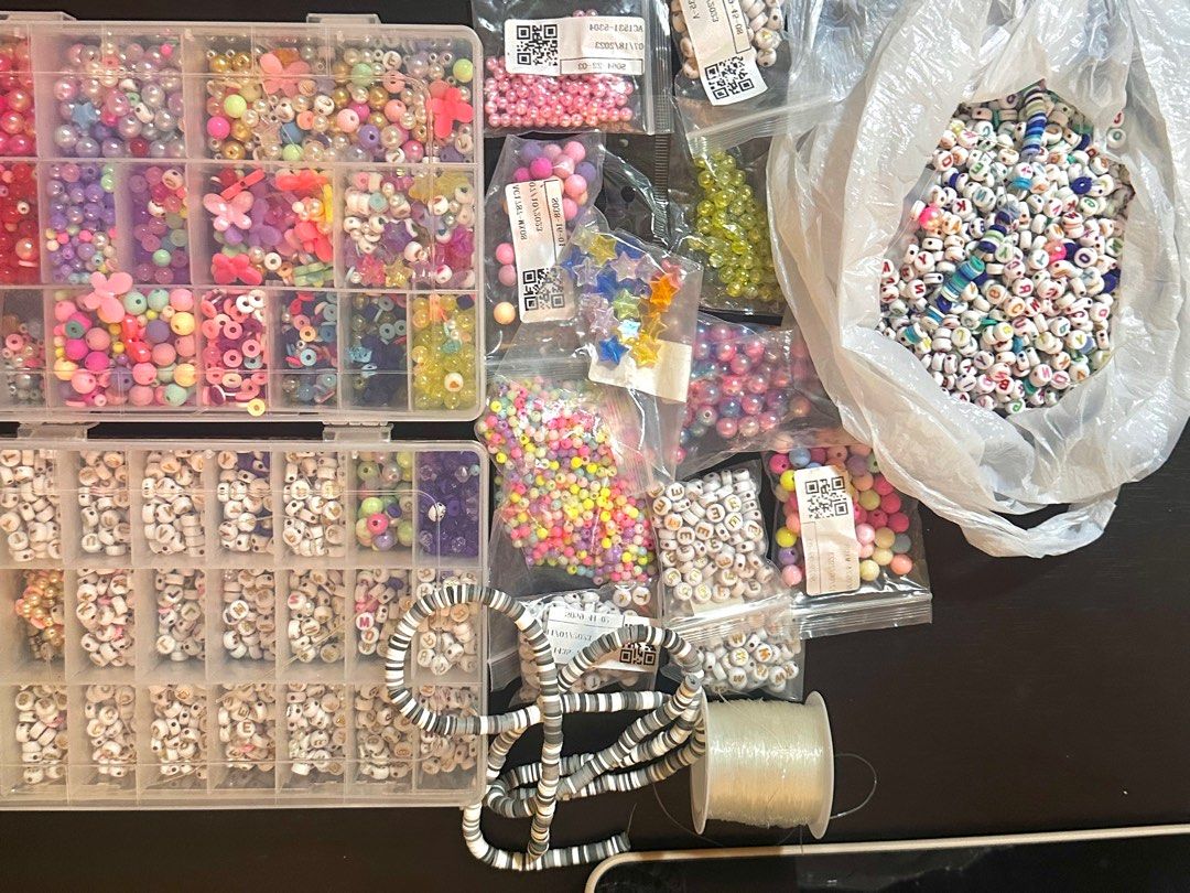 Beads Set (Category: Craft Supplies & Tools) located in Quezon City. Submitted by ak.stt (Listing ID 1413881473, Image 1). Description: - TAKE ALL BEADS SET -Massive bead collection for jewelry making (costs 2k+) - Includes round, star, flower, and letter beads. - Comes with a clear organizer box. - Includes a bag of alphabet beads. - Additional elastic string for easy crafting -Still negotiable for sure buyer.
