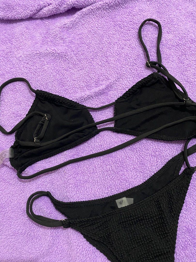Black Textured Bikini Set (Category: Bikinis & Swimsuits) located in Makati City. Submitted by sofiaannedvr (Listing ID 1414030183, Image 2). Description: - Black bikini set - Textured fabric - Adjustable straps - Unique cut-out design on top - Used once - No pads **please communicate properly if interested, let’s not waste our time going back & forth for days. thanks! ✌🏻.