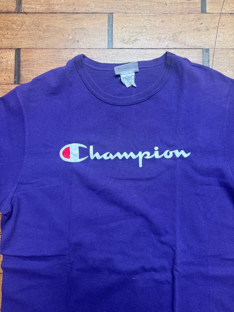 Champion Purple T-shirt - Large (Category: Tshirts & Polo Shirts ) located in San Juan City. Submitted by passionforchic (Listing ID 1413875799, Image 2). Description: - Champion purple t-shirt - Thick material Flaw: print is cracking (see last photo) See close up photos for actual color (looks more blue in first 4 pics) - Size: Large Measurements: - chest 20.5 in (laid flat) - waist 20 in (laid flat) - length 31 in (laid flat) - Features Champio
