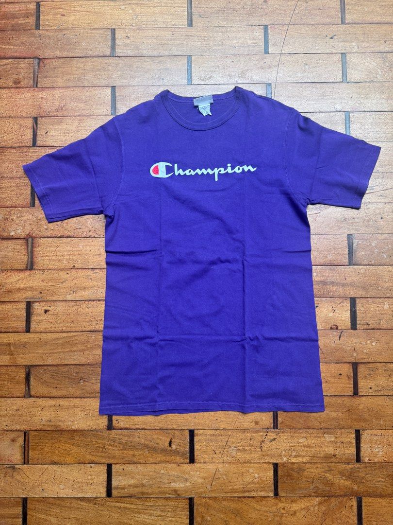 Champion Purple T-shirt - Large (Category: Tshirts & Polo Shirts ) located in San Juan City. Submitted by passionforchic (Listing ID 1413875799, Image 1). Description: - Champion purple t-shirt - Thick material Flaw: print is cracking (see last photo) See close up photos for actual color (looks more blue in first 4 pics) - Size: Large Measurements: - chest 20.5 in (laid flat) - waist 20 in (laid flat) - length 31 in (laid flat) - Features Champio
