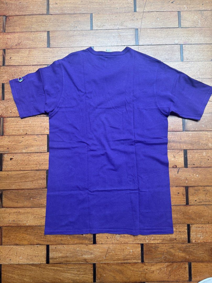 Champion Purple T-shirt - Large (Category: Tshirts & Polo Shirts ) located in San Juan City. Submitted by passionforchic (Listing ID 1413875799, Image 3). Description: - Champion purple t-shirt - Thick material Flaw: print is cracking (see last photo) See close up photos for actual color (looks more blue in first 4 pics) - Size: Large Measurements: - chest 20.5 in (laid flat) - waist 20 in (laid flat) - length 31 in (laid flat) - Features Champio