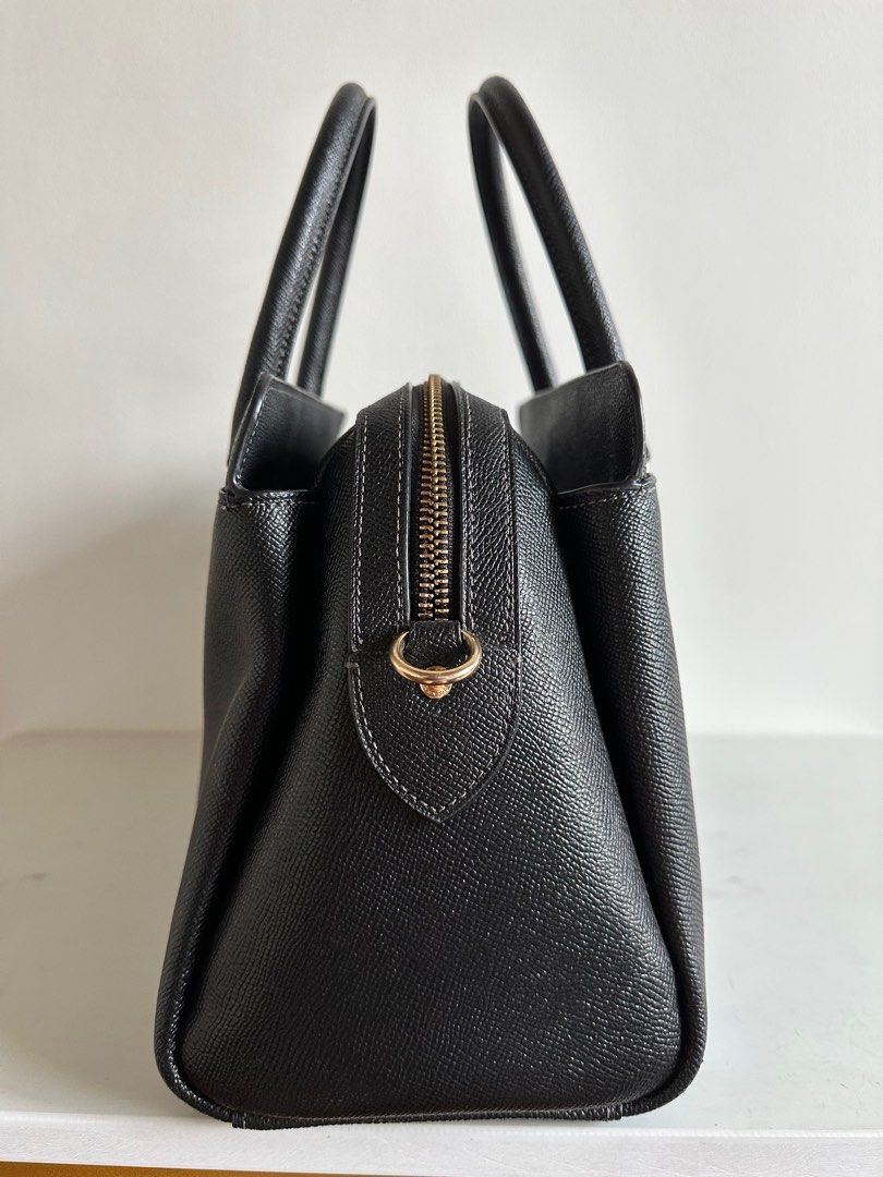 Coach Darcie Caryall (Category: Luxury Bags & Wallets) located in Bulacan. Submitted by shopwithfj_ (Listing ID 1413921753, Image 3). Description: Coach Darcie Caryall In Excellent Condition March 2023 Bought w/ Strap (unused) MEASUREMENTS Length: 12.75" Height: 8.25" Width: 5.5" MATERIALS Crossgrain leather Fabric lining HANDLE Handles with 4.25" drop STRAP Detachable strap with 20.5" drop for shoulder or crossbody wear FEATURES Outside open poc
