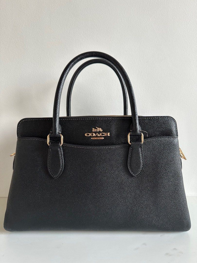 Coach Darcie Caryall (Category: Luxury Bags & Wallets) located in Bulacan. Submitted by shopwithfj_ (Listing ID 1413921753, Image 1). Description: Coach Darcie Caryall In Excellent Condition March 2023 Bought w/ Strap (unused) MEASUREMENTS Length: 12.75" Height: 8.25" Width: 5.5" MATERIALS Crossgrain leather Fabric lining HANDLE Handles with 4.25" drop STRAP Detachable strap with 20.5" drop for shoulder or crossbody wear FEATURES Outside open poc
