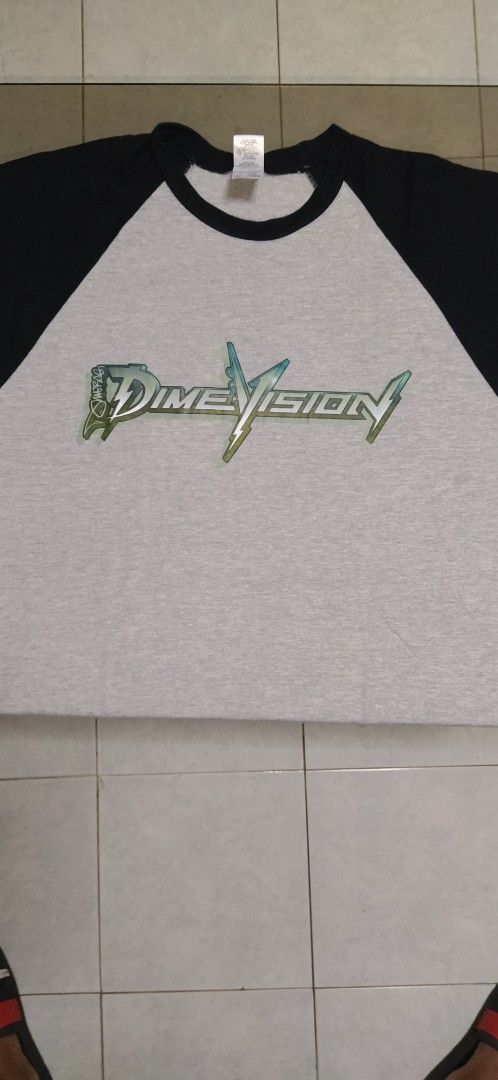 Dimebag Darrell Dimevision Raglan T-shirt (Category: Tshirts & Polo Shirts ) located in Ligao. Submitted by travis40 (Listing ID 1413953072, Image 2). Description: - Dimevision raglan t-shirt - Gray body with black sleeves - Dimevision logo on front - Crew neck - Comfortable fabric.