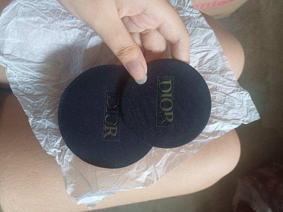 Dior Compact Mirror (Category: Face Care) located in Caloocan City. Submitted by feldsparky89171 (Listing ID 1413999333, Image 3). Description: Dior compact mirror. The mirror is round and has a black fabric exterior with the Dior logo. It comes with a matching black fabric case. The mirror is small and portable, perfect for on-the-go touch-ups..
