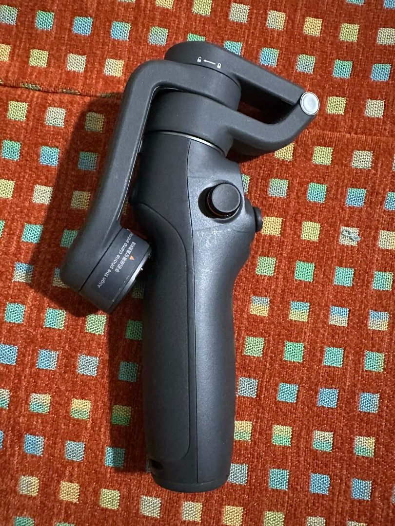 DJI Osmo Mobile 6 Gimbal Stabilizer (Category: Gimbals & Stabilizers ) located in Taguig. Submitted by bautistakr (Listing ID 1413913502, Image 3). Description: - DJI Osmo Mobile 3 gimbal stabilizer - Includes: gimbal, carrying pouch, tripod, phone holder, and charging cable - Foldable design for easy portability - Provides smooth video stabilization - Perfect for professional-looking videos on the go - No issue / Barely used RFS: Naka osmo pocke