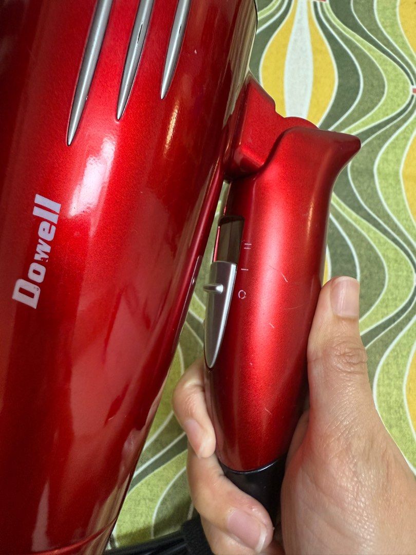 Dowell Hair Dryer (Category: Hair) located in Quezon City. Submitted by _cmls (Listing ID 1413983136, Image 3). Description: - Dowell hair dryer - Good working condition - High and low heat settings - Sleek design with silver accents - Power switch on handle - Includes black power cord with velcro strap.