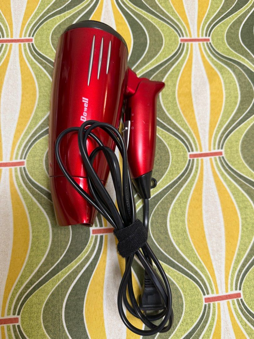 Dowell Hair Dryer (Category: Hair) located in Quezon City. Submitted by _cmls (Listing ID 1413983136, Image 2). Description: - Dowell hair dryer - Good working condition - High and low heat settings - Sleek design with silver accents - Power switch on handle - Includes black power cord with velcro strap.