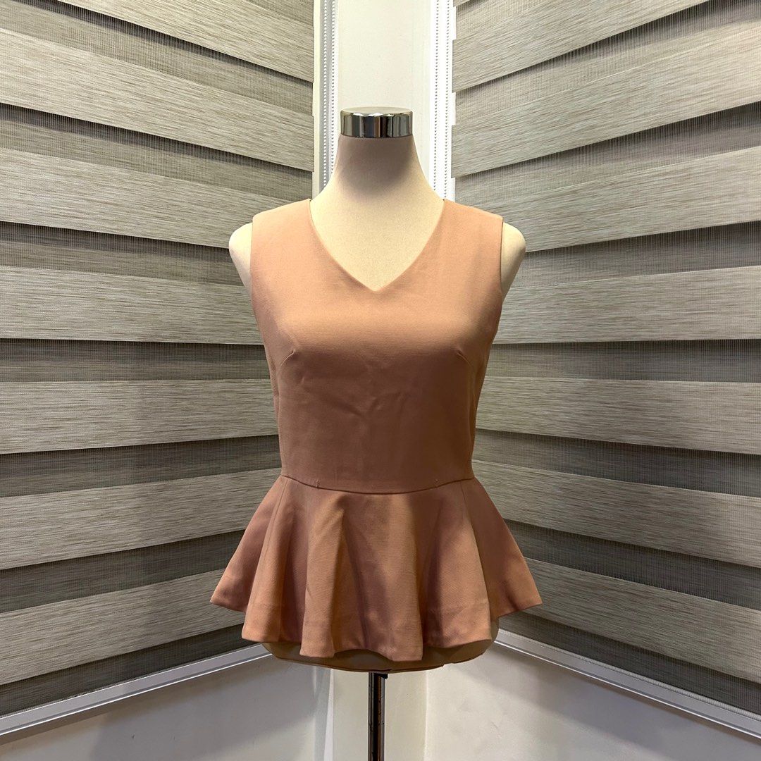 Espada Peplum Top - Beige (Category: Blouses) located in Quezon City. Submitted by nowthatslegitph (Listing ID 1413952795, Image 1). Description: Message for Measurements! Size on Tag: M, USA 4, EUR 36 - Elegant Espada top - Flattering peplum style - V-neck design - Fitted silhouette - Concealed zipper at the back - Color is a soft, neutral tone Issue! - Two tiny pinholes (See last pic).