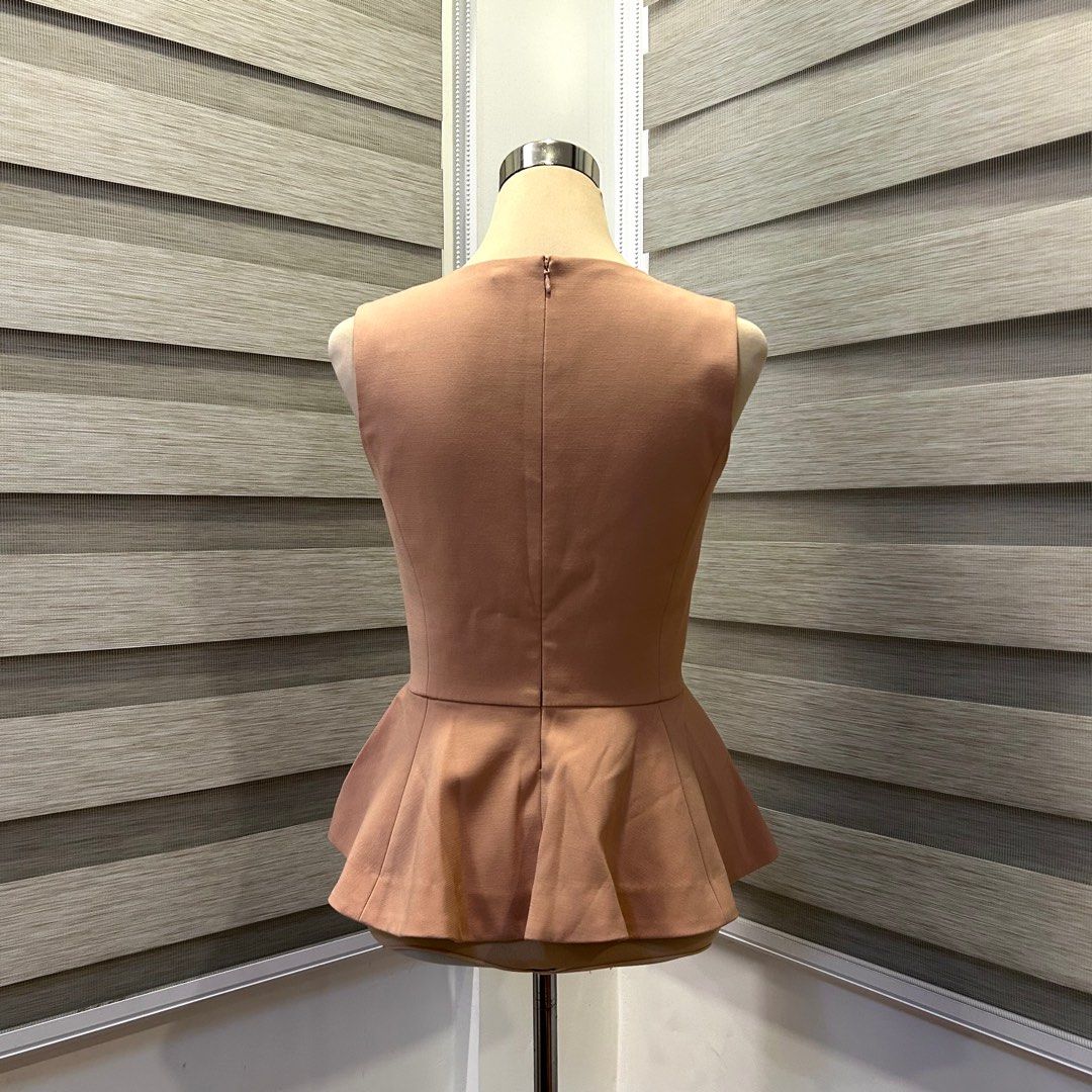 Espada Peplum Top - Beige (Category: Blouses) located in Quezon City. Submitted by nowthatslegitph (Listing ID 1413952795, Image 3). Description: Message for Measurements! Size on Tag: M, USA 4, EUR 36 - Elegant Espada top - Flattering peplum style - V-neck design - Fitted silhouette - Concealed zipper at the back - Color is a soft, neutral tone Issue! - Two tiny pinholes (See last pic).
