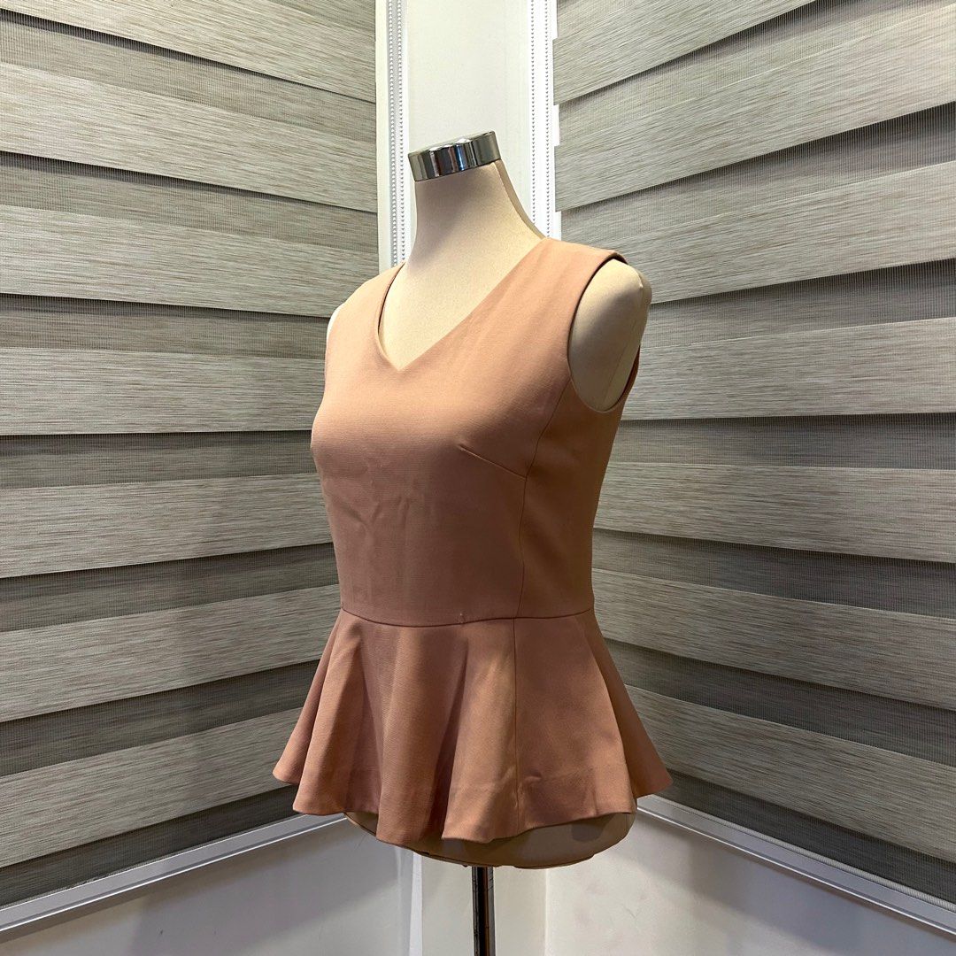 Espada Peplum Top - Beige (Category: Blouses) located in Quezon City. Submitted by nowthatslegitph (Listing ID 1413952795, Image 2). Description: Message for Measurements! Size on Tag: M, USA 4, EUR 36 - Elegant Espada top - Flattering peplum style - V-neck design - Fitted silhouette - Concealed zipper at the back - Color is a soft, neutral tone Issue! - Two tiny pinholes (See last pic).