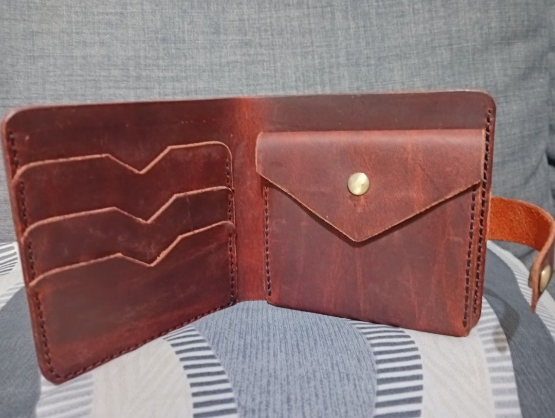 Genuine Leather Wallet with Coin pocket (Category: Wallets & Card holders) located in Hermosa. Submitted by chic2315 (Listing ID 1413246584, Image 1). Description: Handmade leather wallet with coin pocket. Color dark red. This is made of cow leather and full grain. Only used twice. Very durable po ito, and hindi nagbabakbak ang leather. This is also local made. It has 4 card holder, pwede pong lagyan ng card or ID yung likod ng coin pocket. .