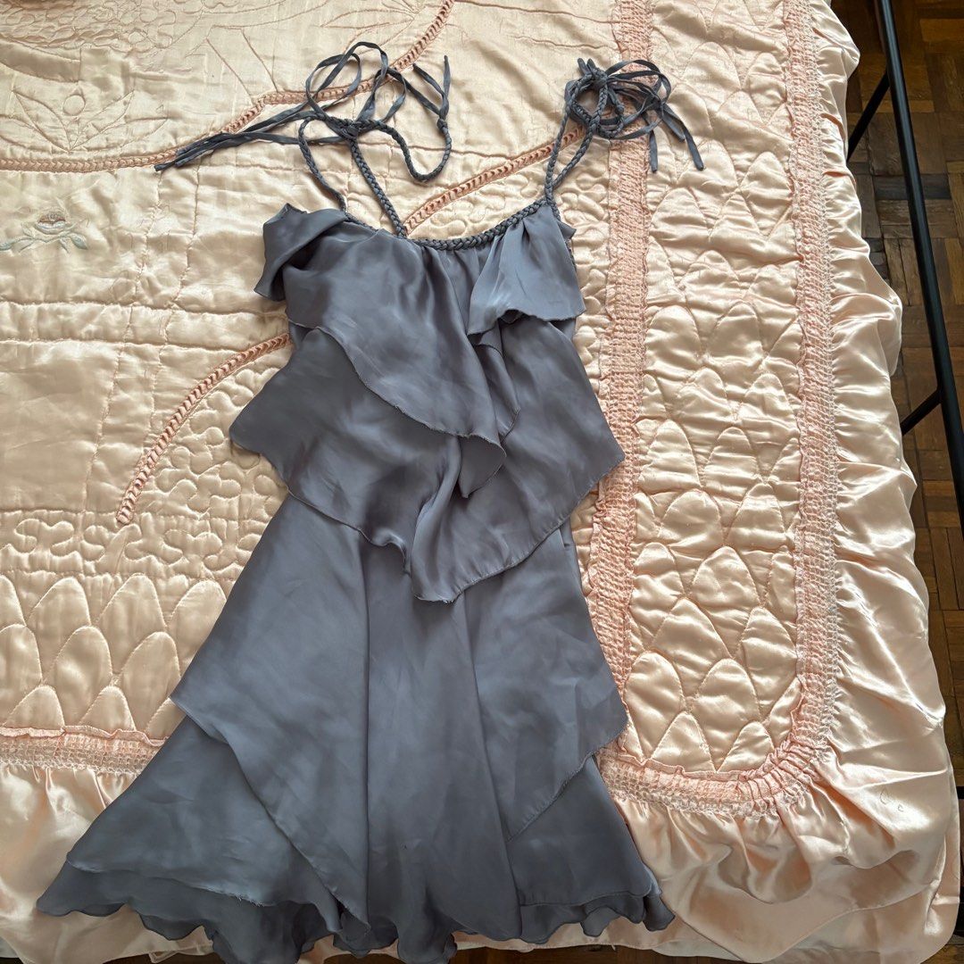 Gray Ruffle Short Dress (Category: Dresses) located in Las Pinas. Submitted by slowcircle (Listing ID 1413951518, Image 2). Description: - Gray dress with layered ruffles - Size: M - Braided straps - Back zipper closure - Silky material - Perfect for special occasions.