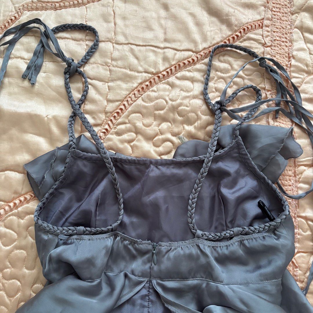 Gray Ruffle Short Dress (Category: Dresses) located in Las Pinas. Submitted by slowcircle (Listing ID 1413951518, Image 3). Description: - Gray dress with layered ruffles - Size: M - Braided straps - Back zipper closure - Silky material - Perfect for special occasions.