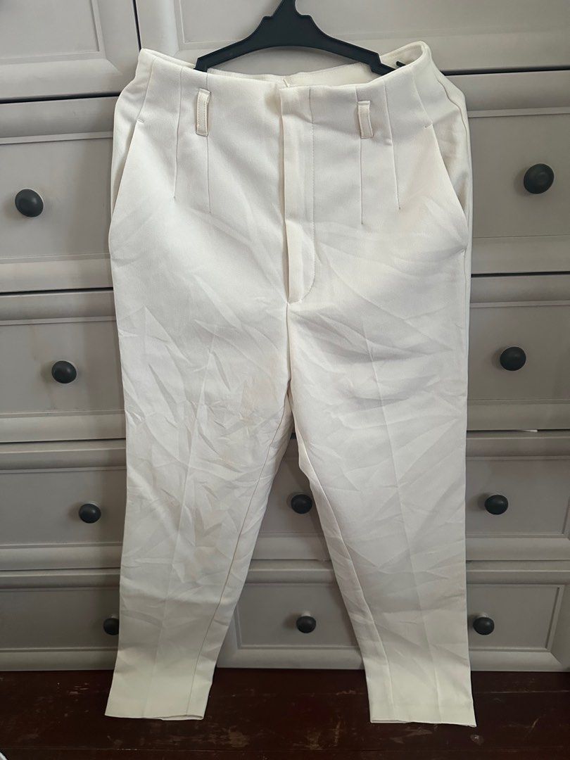 GU Cream-colored Trousers - Size M (Category: Other Bottoms) located in Paranaque City. Submitted by copsartorial (Listing ID 1413908854, Image 2). Description: - Cream-colored trousers - High-waisted - Straight leg - Size M - Two front pockets - Button closure - Simple back design.