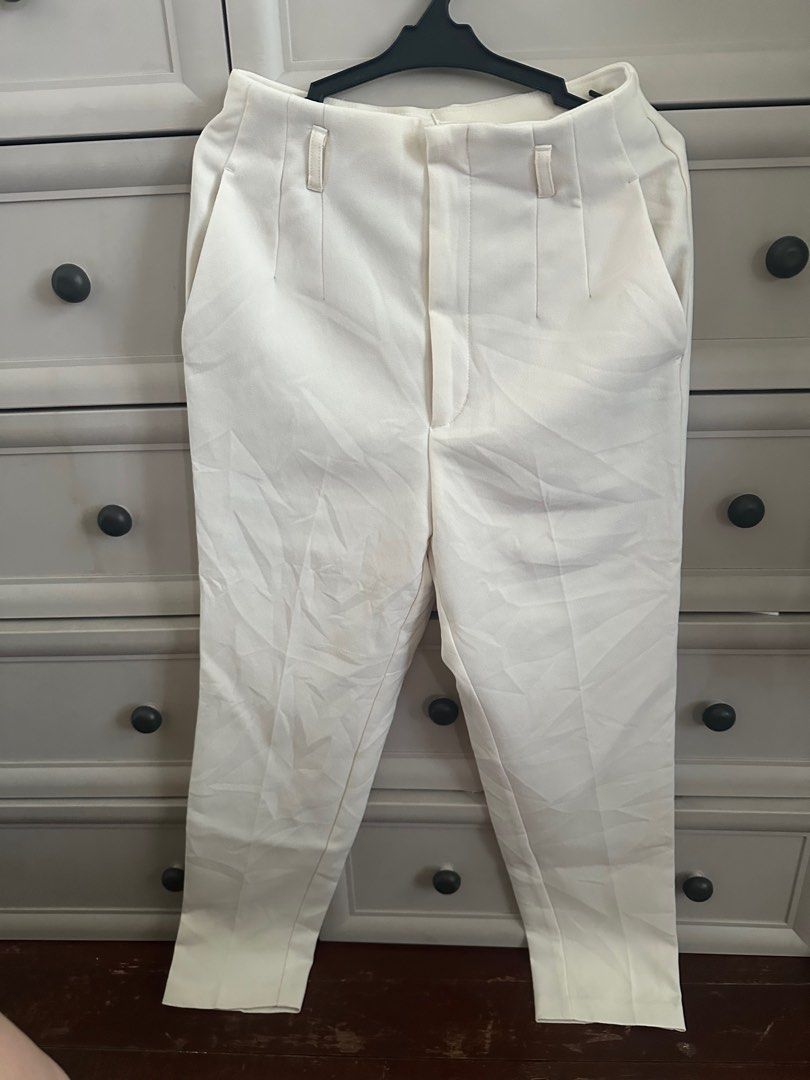 GU Cream-colored Trousers - Size M (Category: Other Bottoms) located in Paranaque City. Submitted by copsartorial (Listing ID 1413908854, Image 1). Description: - Cream-colored trousers - High-waisted - Straight leg - Size M - Two front pockets - Button closure - Simple back design.