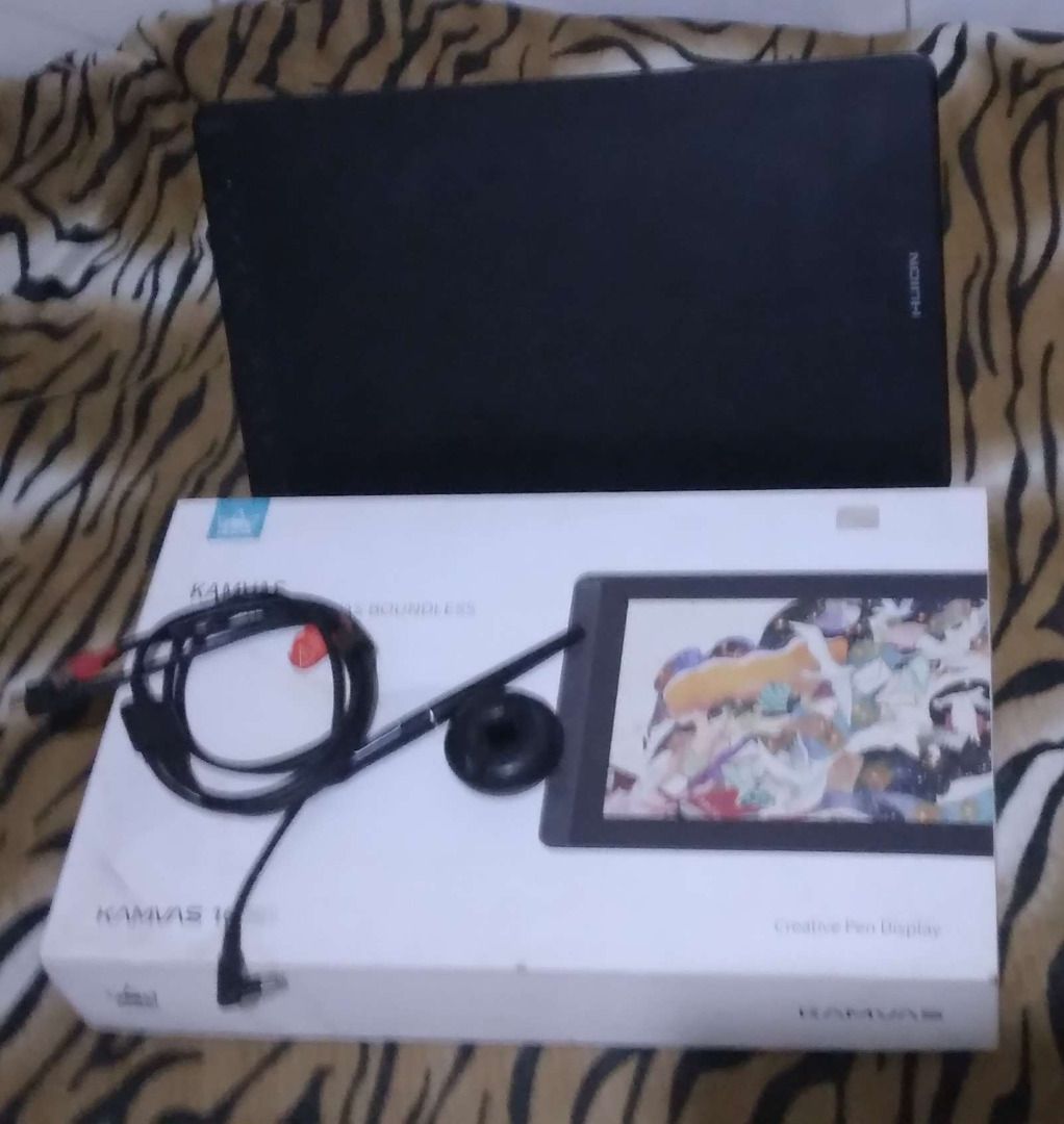 [RUSH!] Huion Kamvas 16 Drawing Tablet (Category: Others) located in Quezon City. Submitted by Tobywoby (Listing ID 1414042796, Image 3). Description: - Huion Kamvas 16 drawing tablet with pen display. - Includes original box, cables, and pen. - Features a vibrant display. - Black tablet with Huion logo. - Originally purchased for PHP 16,500 - NO ISSUES!!! Send any inquiries through Carousell if you're interested..