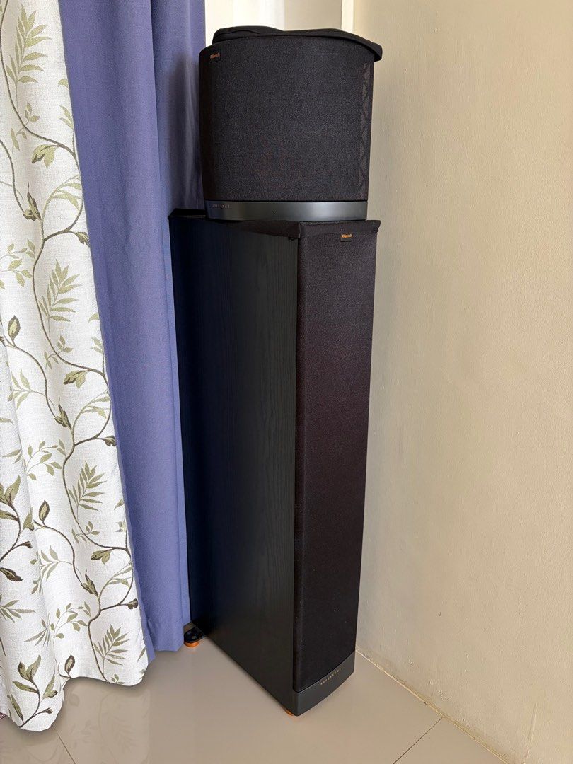 Klipsch Speakers (Category: Soundbars, Speakers & Amplifiers) located in Padre Garcia. Submitted by noblefish.b667c0 (Listing ID 1413905276, Image 1). Description: - Klipsch speaker set - Includes one tall floor-standing speaker - Includes one smaller speaker - Both speakers are black - Floor-standing speaker has a rectangular shape with fabric covering - Smaller speaker has a curved top - Designed for audio playback.